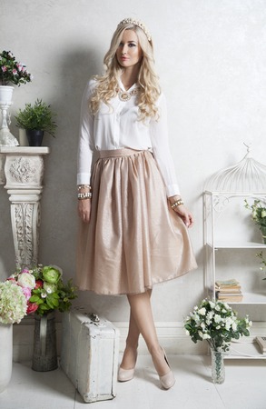 Young beautiful girl posing at light studioの写真素材