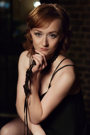 Young pretty girl in black lingerieの写真素材