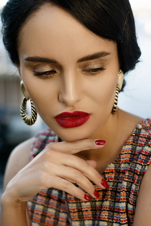 Beautiful young woman in urban look at waterfrontの写真素材