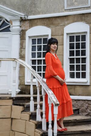 Beautiful pregnant lady in nice dressの写真素材