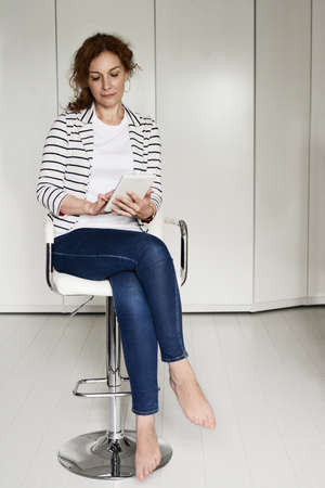 Mature business woman have a rest in home