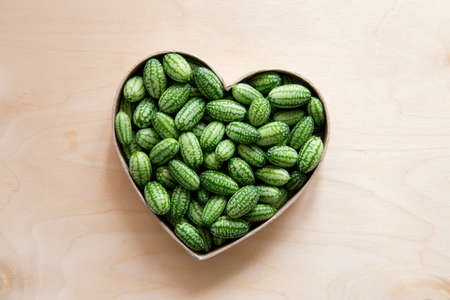 Melothria scabra, also known as the cucamelon or pepquinos is small edible fruit witch tastes like...