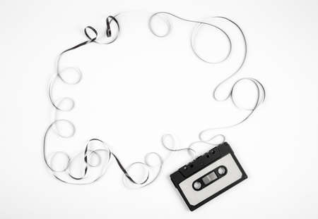 Analogue cassette tape on white background, 80s retro frame, lot of empty copy space.の写真素材