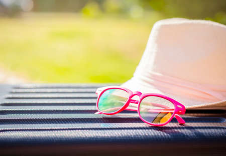 Selective focus on kids pink sunglasses, holiday with kids concept background, lot of copy space.の写真素材
