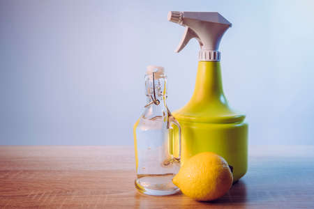 White vinegar cleaning products concept. Spay bottle with cleaning solution, lot of copy space.の写真素材