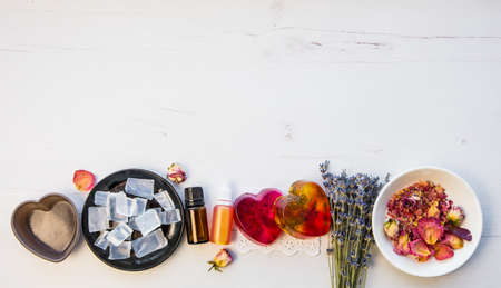 Making handmade soap with crystal clear melt and pour soap mixture. Ready to use pink and yellow...