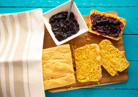 Cornbread is bread containing cornmeal, corn flour. Beautiful yellow sliced cornbread loaf with...