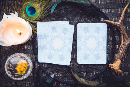Deck with divination homemade Angel cards on black table, surrounded with semi precious stones crystals.の写真素材
