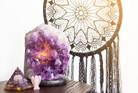 Spiritual home decor concept. Various elements: Orgonite or Orgone pyramid, black color dream...