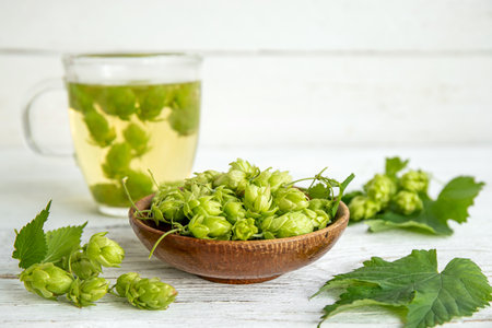 Herbal medicinal tea drink made of Humulus lupulus, the common hop or hops. Hops flowers with tea...