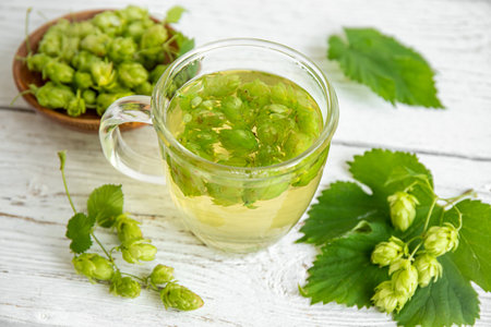 Herbal medicinal tea drink made of Humulus lupulus, the common hop or hops. Hops flowers with tea...