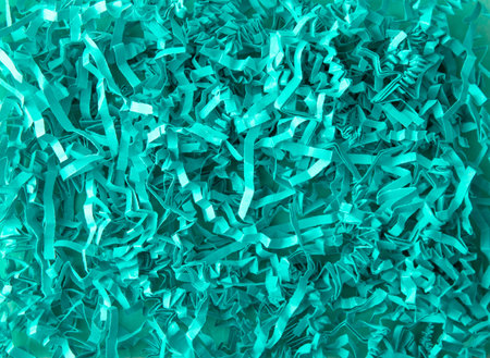 Mint green color shredded paper - gift box filler background.の写真素材