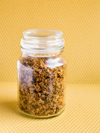 Propolis or bee glue is a resinous mixture that honey bees produce by mixing saliva and beeswax, gathered from tree buds, sap flows, or other botanical sources. Antibacterial medicの写真素材