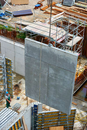 Crane lifts on construction site
