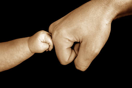 baby touching dadの写真素材