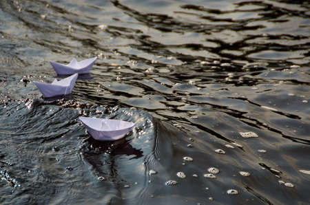 paper boat in heavy sea