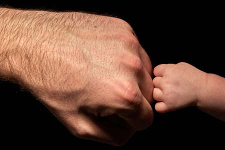 baby strong touching dadの写真素材