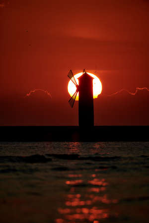 Sunrise at stawa mlyny lighthouse in Swinoujscie Poland
