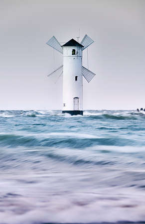 flood in swinoujscie mills lighthouseの写真素材