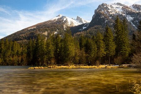 Mountain lake in thae Bavarian Alps in spring and snow on the mountains.の写真素材