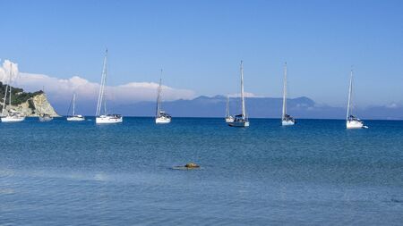 Sailing ships moored in a bay in Greeceの写真素材