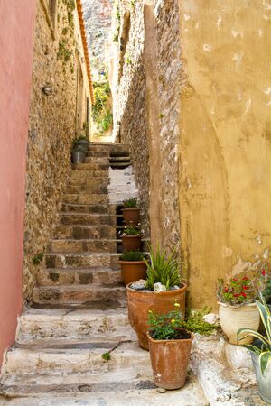 Narrow stairs between two old housesの写真素材