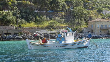 Greek fishing boat on the seaの写真素材