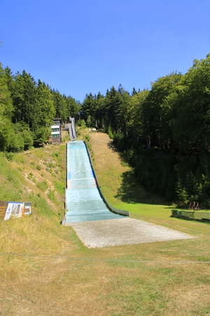 Ski jumping facility on the Wurmberg in the Harz near Goslar in summer with sunshineの写真素材