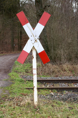 St. Andrew's Cross at an unmarked railroad crossing of the Strohg?ubahn in the Heckeng?u near Weissachの写真素材