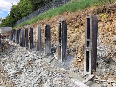 Steel girders were concreted in the ground for slope protection