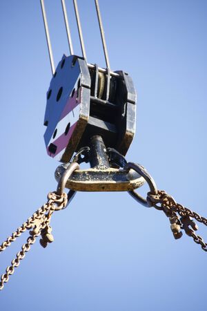 Hook on a construction crane, for taking heavy weights with a chainの写真素材