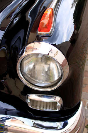 Combination of parking light, low beam and indicator on a classic car