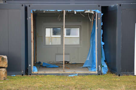 Old containers for living are stored in a storage yard