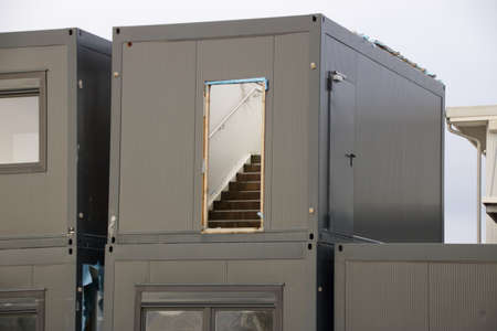 Old containers for living are stored in a storage yard