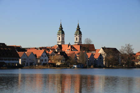 View of the town of Bad Waldsee. The towers of the collegiate church are reflected in the city lakeのeditorial素材