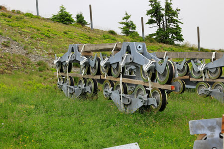 Material for building a new cable car lies on a meadow