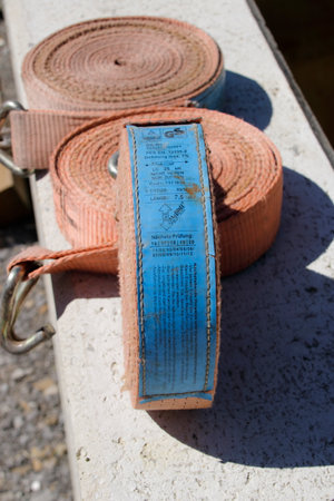 Nameplate of a tension strap for securing loads