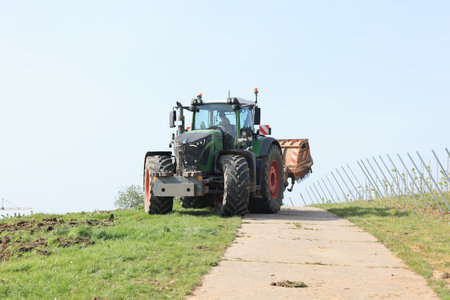 Tractor on the road in the countryside, closeup of photoのeditorial素材