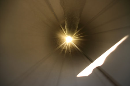 Looking through a long pipe into the lightの写真素材