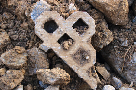 Concrete lawn paving stone was broken and was thrown awayの写真素材