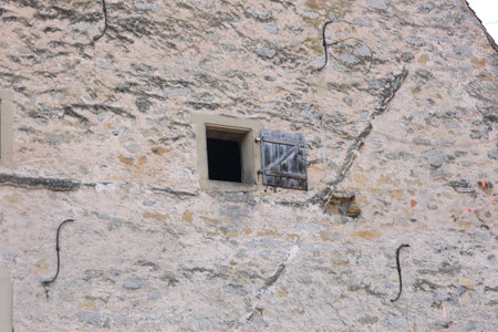 Open window in a stone facadeの写真素材