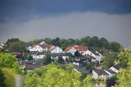 Storm clouds over the town of Weissach im HeckengÃ¤uの写真素材