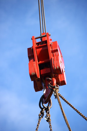 Load hook from a mobile crane against a blue sky