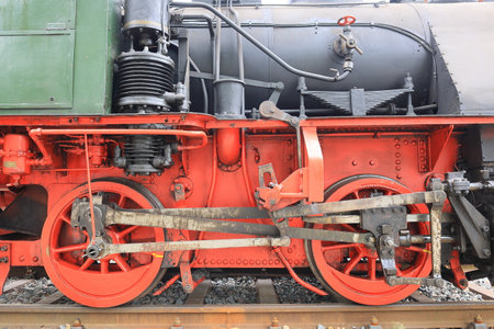 Close-up of the wheels of a steam locomotive
