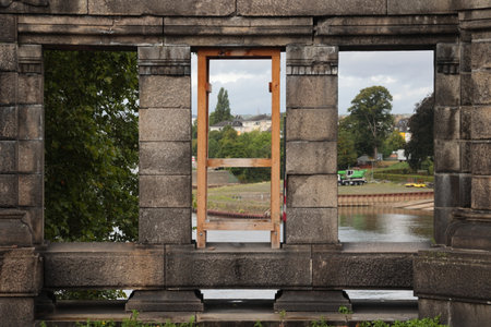 The opening is secured against falling over with wooden beams.