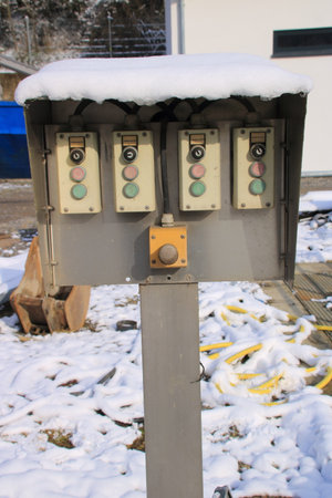 The protective roof over a key switch is covered with snow.