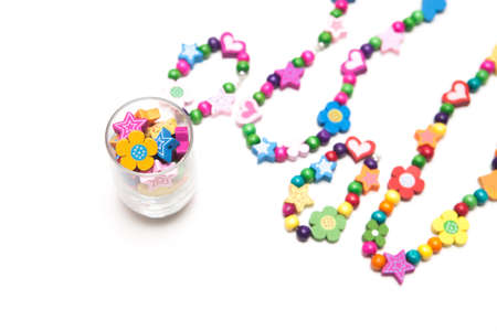 Kids beaded jewellery isolated on whiteの写真素材