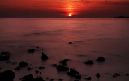 Beautiful sunset with rocks in Zaton nearZadar, Croatiaの写真素材