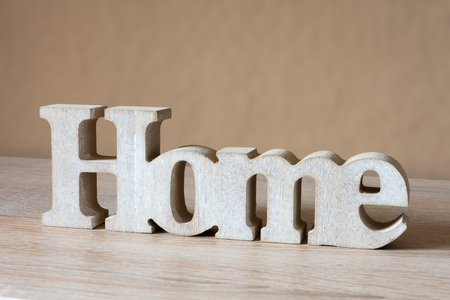 Wooden letters Home - Decorative Word On Wooden Plateの写真素材