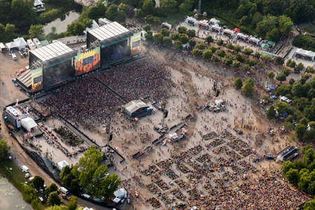 Montreal, August 8, 2014. Aerial view of the crowd enjoying various open air concerts at the main stage of the Osheaga arts & music summer festival on Ste-Helen Island.のeditorial素材